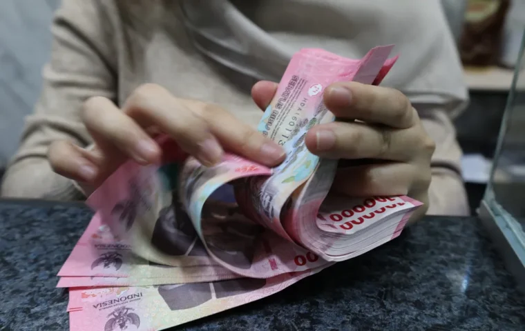Pelemahan Rupiah Terpengaruh Sentimen Global dan Domestik